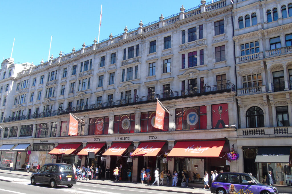 Styles Façade Solutions® captured this pre-cleaning view of the historic Hamleys, London, documenting the ornate stone façade's uneven soiling and discolouration prior to treatment with the Façade Gommage cleaning process, which will restore the stonework's original bright, uniform appearance.
