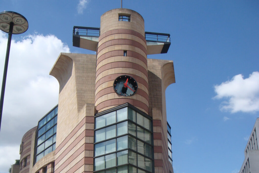 Styles Façade Solutions® documents the striking clock tower at 1 Poultry, London, ahead of scaffold-free façade cleaning, showing the building's bold banded stonework and architectural features prior to treatment, which will refresh the distinctive postmodern façade.