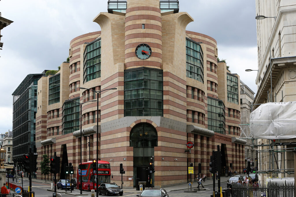 Styles Façade Solutions® completes a scaffold-free façade cleaning at 1 Poultry, London, revealing the building's bold banded stonework restored to a bright, uniform finish, showcasing the distinctive postmodern architecture at this busy junction without the need for traditional scaffolding.