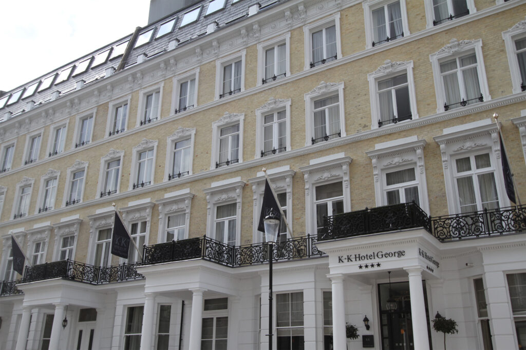 Styles Façade Solutions® completes the restoration of 1-15 Templeton Place, London, delivering a refreshed brick and stucco façade with crisp white detailing, restored ironwork balconies, and a smart entrance portico for the K+K Hotel George, showcasing high-quality commercial façade repair and renovation work.