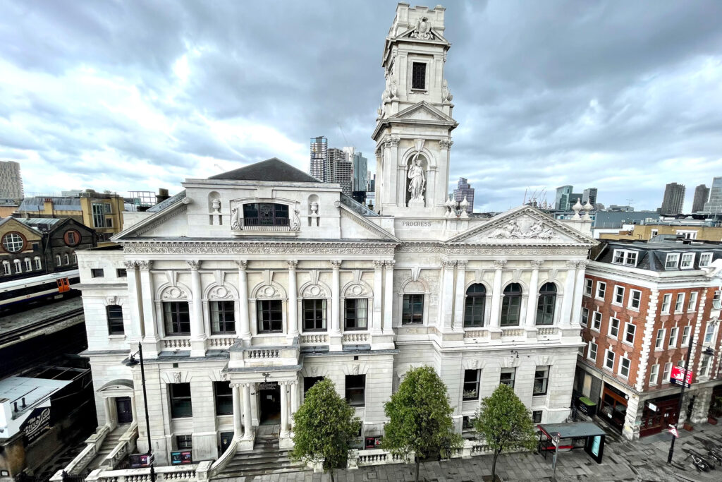 Styles Façade Solutions® delivers outstanding results at Shoreditch Town Hall, restoring over a century of grime to reveal a bright, pristine façade. This elevated view showcases the full transformation, demonstrating the expertise, precision, and lasting value Styles Façade Solutions® brings to heritage building restoration projects.