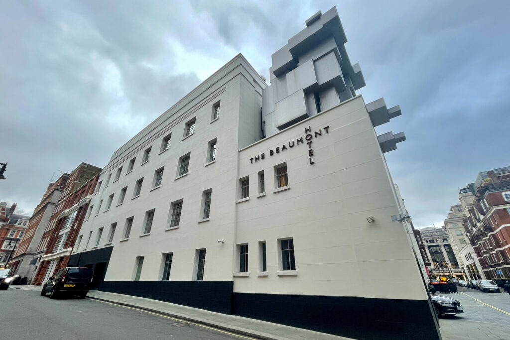 Styles Façade Solutions® prepares to carry out redecoration works on the Grade II listed Beaumont Hotel in London. The Art Deco building's cream stone façade and Antony Gormley's striking cubist sculpture "Room" feature prominently.