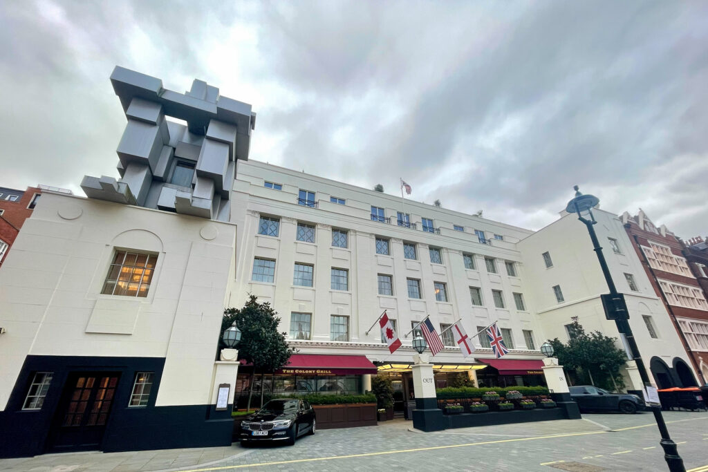 Styles Façade Solutions® completes façade redecoration works at the Grade II listed Beaumont Hotel in London. The cream Art Deco building looks freshly finished, with Antony Gormley's sculpture "Room" prominent.