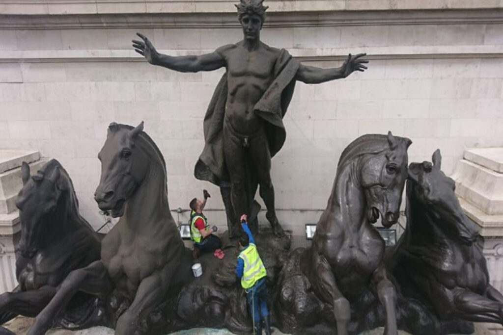 Styles Façade Solutions® undertook an 18-day clean of "Phoebus Driving The Horses of The Sun" by Sir Bertram Mackennal at Australia House, London. This monumental bronze sculpture, over 6 metres high and 18 metres wide, is shown here displaying weathering prior to treatment.