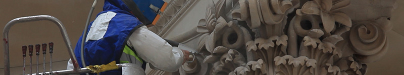 Close up image of cleaning of the façade of a commercial building