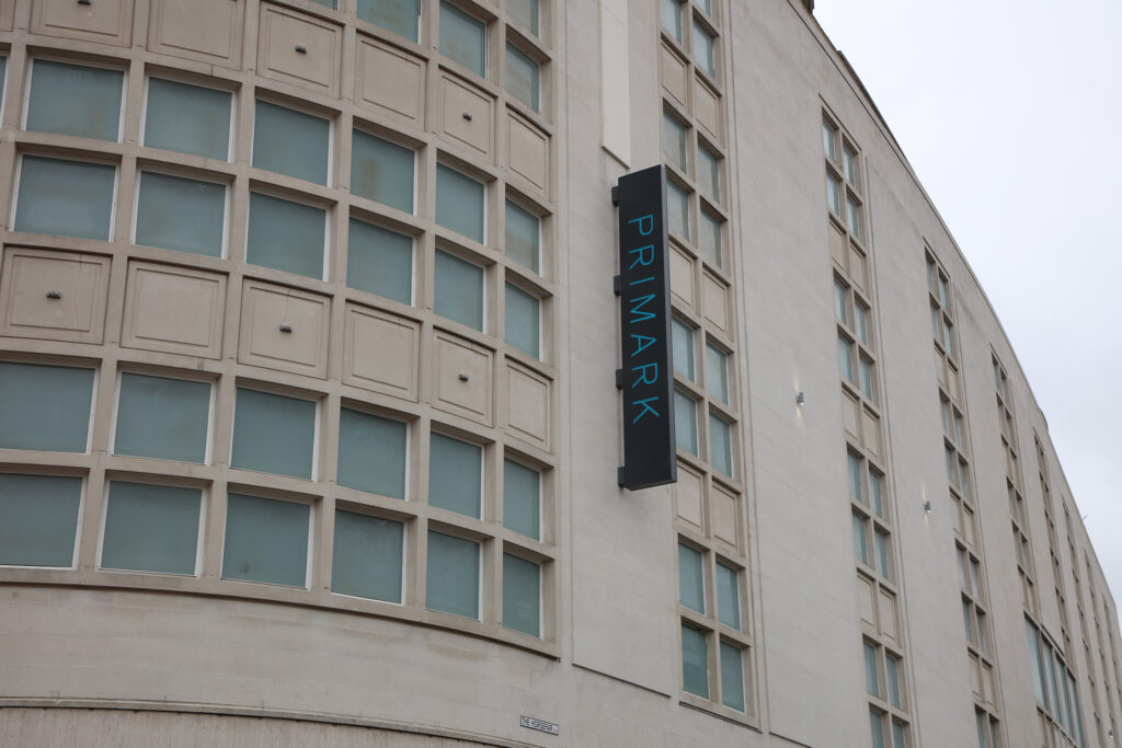 Styles Façade Solutions® completes façade cleaning and window redecoration at 1-27 Horsefair, Bristol, home to Primark. The Portland stone building now appears clean and uniform in tone, with freshly painted window frames, showcasing the finished restoration.