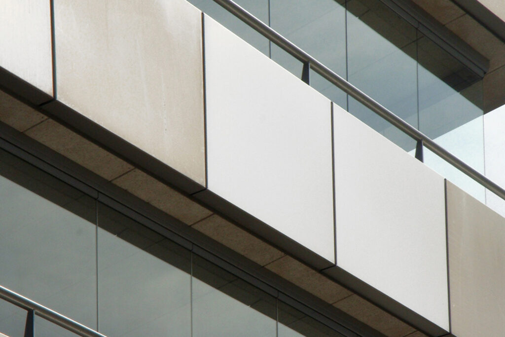 Styles Façade Solutions® showcases the dramatic contrast between a cleaned, bright anodised aluminium panel and its weathered neighbour during façade restoration, clearly demonstrating the transformative results achieved through professional cleaning and restoration work.
