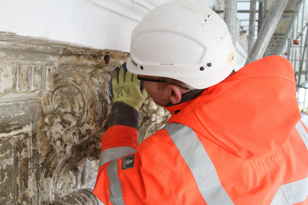 Styles Façade Solutions® carry out detailed hands-on restoration assessment of an ornate plaster capital at Miiro Templeton Garden, London (formerly K+K Hotel George Kensington). With its intricate scrollwork and decorative mouldings it requires specialist conservation attention as part of the wider façade restoration programme.