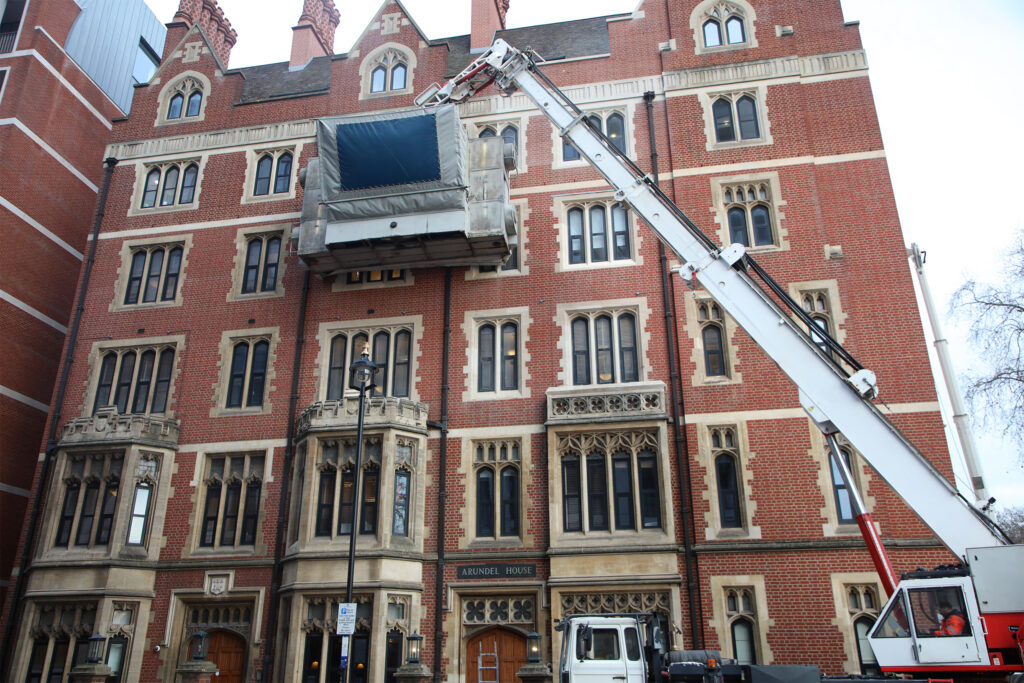 Styles Façade Solutions® cleaning the Red brick and Portland stone façade of Arundel House, London. The scaffold-free process gently erases decades of dirt and grime without the need for expensive, time-consuming and intrusive scaffolding.