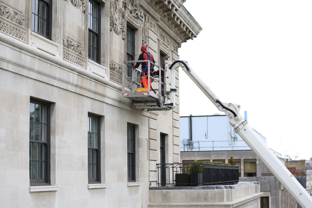 Styles Façade Solutions® provides a truck-mounted platform and fully certified, trained IPAF driver operator on hire, enabling safe close-up access to intricate stone façade detailing.