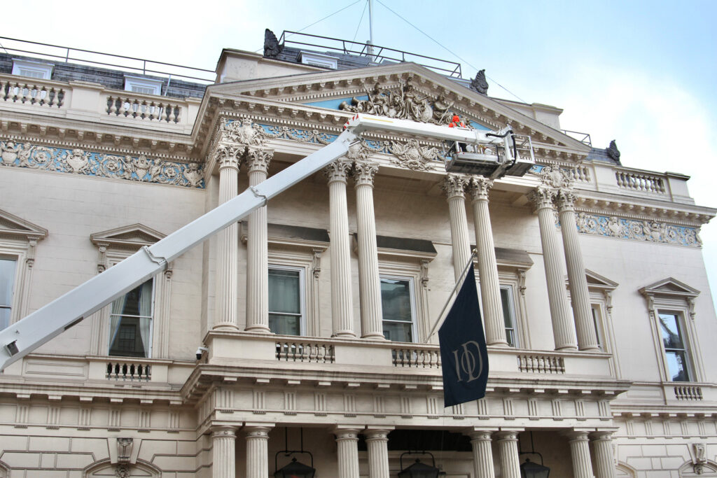 Styles Façade Solutions® provides a truck-mounted platform with a fully certified, trained IPAF operator, reaching the ornate pediment of the Institute of Directors building. The elevated cradle enables close, precise access to intricate carved stonework and Corinthian columns high above Pall Mall.