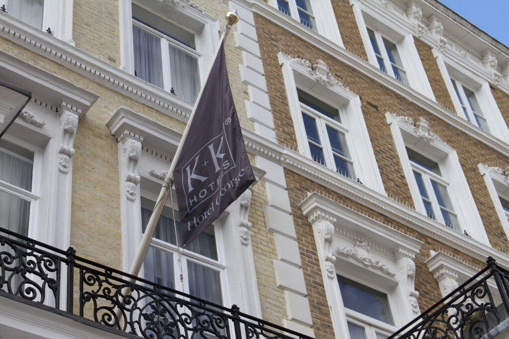 Styles Façade Solutions® completed the restoration and repainting of these sash windows at Miiro Templeton Garden, formerly K+K Hotel George. The qualified painting team's crisp white finish highlights the building's ornate stone corbels and decorative window surrounds, set against classic London brickwork.