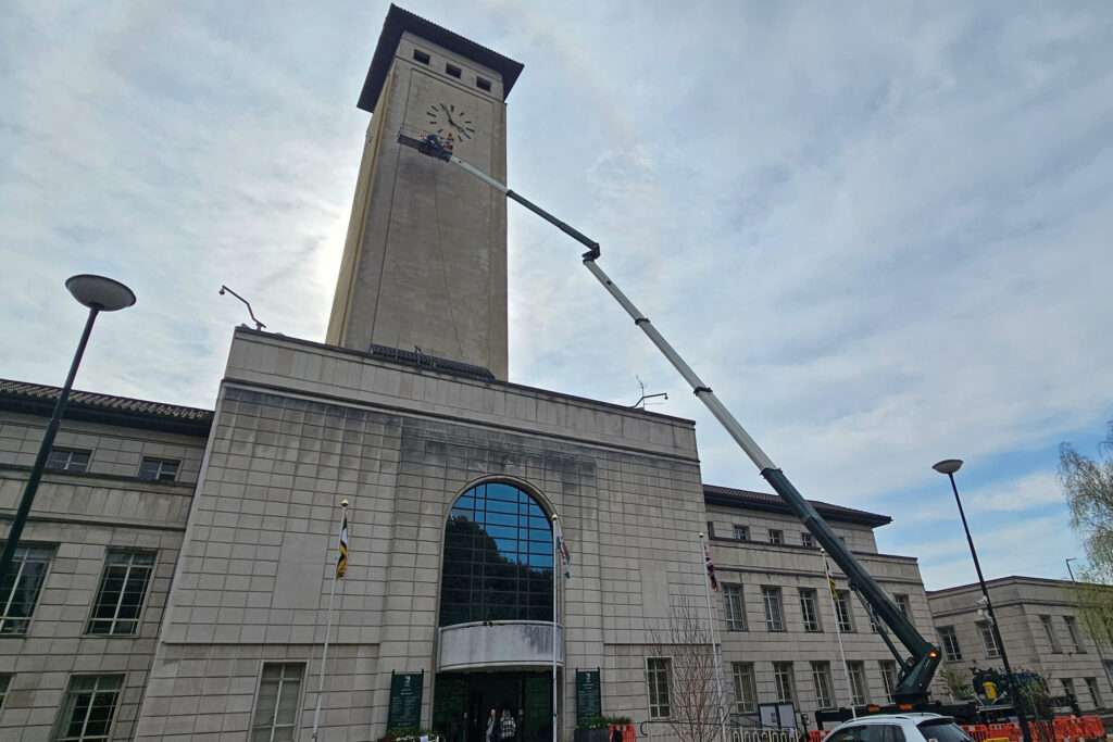 Styles Façade Solutions (formerly Thomann-Hanry®) uses a MEWP to conduct a scaffold-free survey of the Clock Tower at Newport Civic Centre. The elevated platform positions operatives directly beside the clock face, allowing close inspection of the tower's weathered stonework without the need for expensive and unsightly scaffolding.