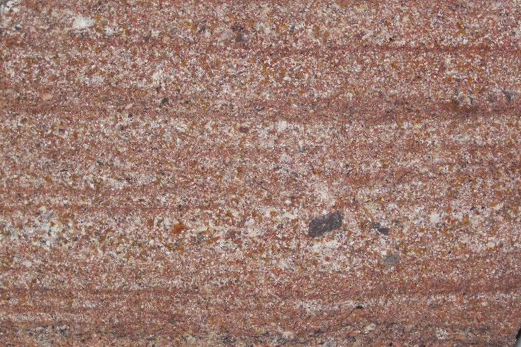 Styles Façade Solutions® showcases New Red Sandstone, a bold terracotta stone among the UK's most distinctive façade materials. Its warm reddish tones and granular texture create a striking, durable finish, ideal for heritage restoration and commercial buildings seeking a characterful natural stone appearance.