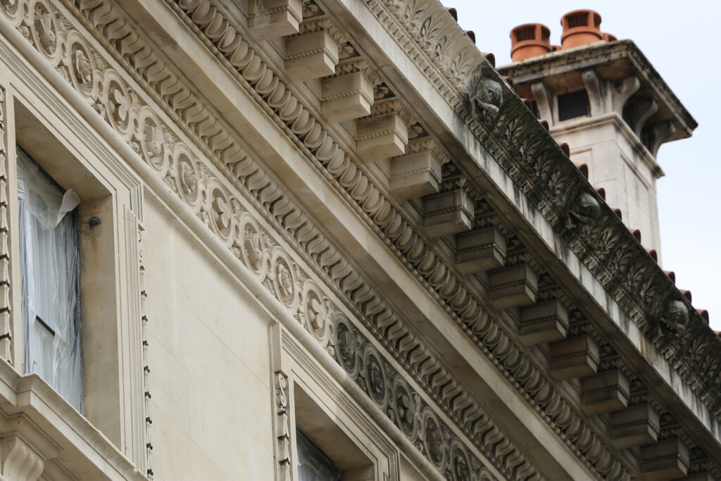 Styles Façade Solutions® uses Façade Gommage cleaning to gently and effectively remove decades of urban soiling from ornate stonework, restoring intricate carved detailing and original colour without damaging delicate surfaces, all achieved through a scaffold-free, dust-controlled process suited to historic buildings.