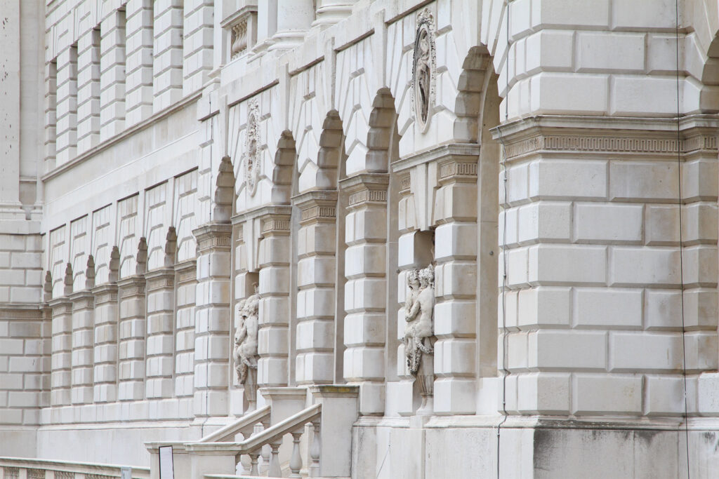 Styles Façade Solutions® delivering pristine results through heritage-grade Façade Gommage cleaning at the Grade I listed Somerset House, London. The gently restored Portland stone façade reveals crisp rusticated detailing and carved figures, showcasing careful conservation methods that preserve delicate stonework while achieving a beautifully refreshed finish.